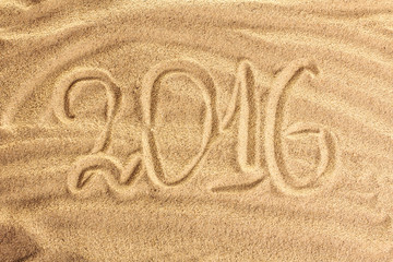 congratulation happy new year on sea sand background