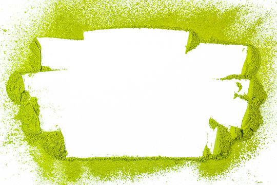 border surface close up of powdered green tea isolated on white