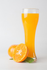 Orange juice and slices of orange isolated on white