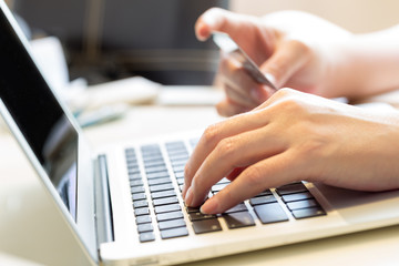 woman holding credit card on laptop for online shopping concept