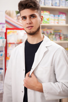 Doctor inside pharmacy looking at you