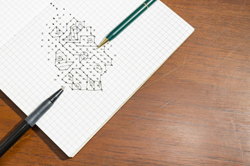 dots game in notebook on wood texture