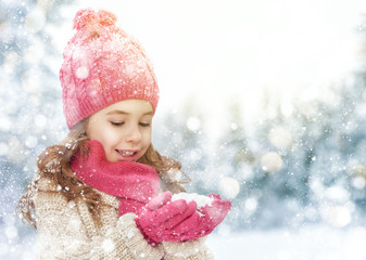 girl playing on a winter walk