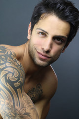 portrait of a handsome tattooed man 