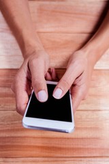 Part of hands typing on smartphone