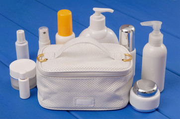 white  handbag and cosmetic  preparations