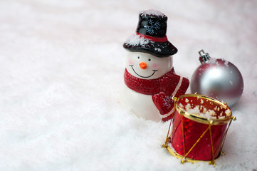 Christmas composition with snowman and light bokeh, closeup