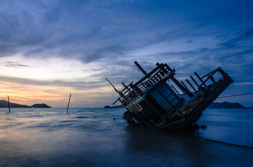 Fototapeta na wymiar Wreck ship on the beach in sunrise