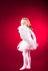 Beautiful blond hair angel on a red background