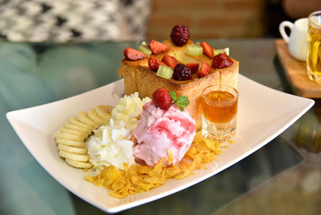 Honey toast with strawberry ice cream and honey syrup