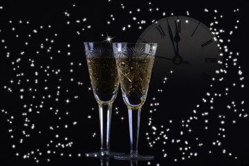New Year's background and two glasses champagne