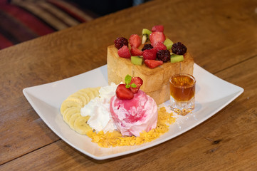 Honey toast with strawberry ice cream and honey syrup