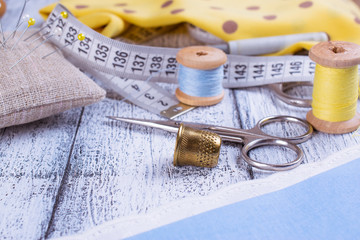Tools for sewing and fabric on wooden boards