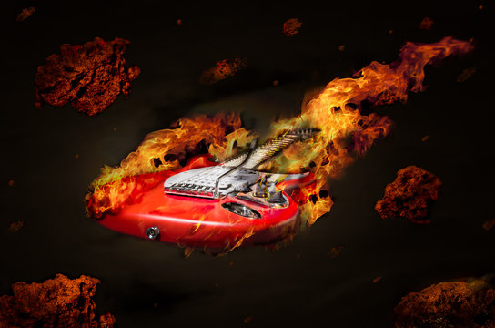 Burning guitar flying in space among meteorites