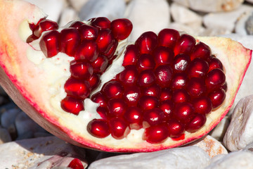 Part of pomegranate fruit. Organic fresh juicy product