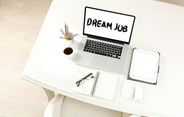 Dream job concept. Laptop with tablet and smart phone on Workplace top view