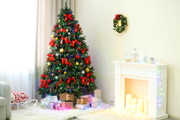 Perfect Christmas tree with gifts underneath in living room