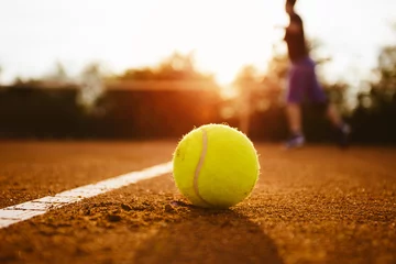 Foto op Plexiglas Silhouette of player on a tennis court © yossarian6