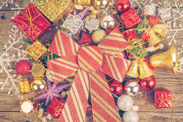 Christmas background with decorations bow and  gift boxes on woo