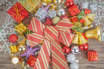 Fototapeta premium Christmas background with decorations bow and gift boxes on woo