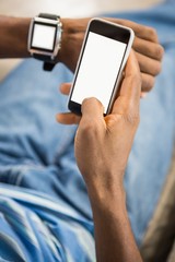 Close up view of a casual man using smart watch