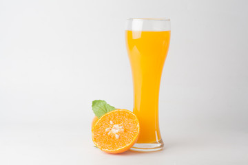 Orange juice and slices of orange isolated on white