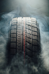 winter tire in smoke