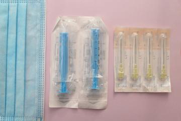 Surgical mask, syringe and needle - sterile medicine equipment