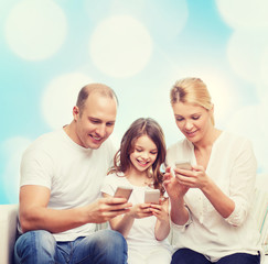 happy family with smartphones