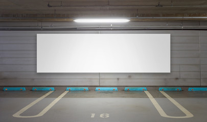 Parking garage underground interior with blank billboard