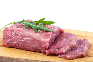 Meat on a cutting board on white background.