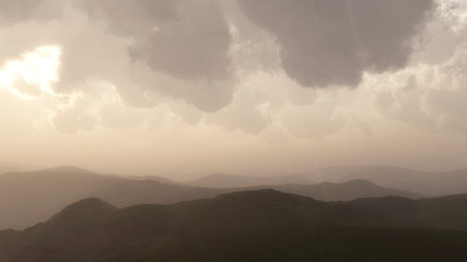 Obraz premium Mountain landscape in rain with stormy sky.