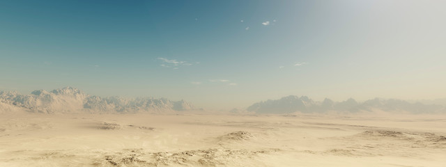 Sandy desert landscape with blue sky.