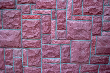 purple hued rectangular shaped stone wall