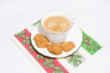 White cup of espresso coffee with cookies