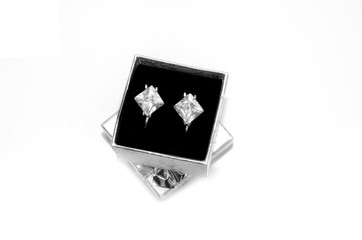 Luxury earrings in light box isolated