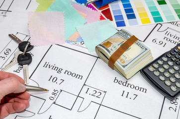 Planning of construction of the house with color pallete, keys, dollar, calculator