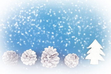 pinecones with snowflakes on blue background