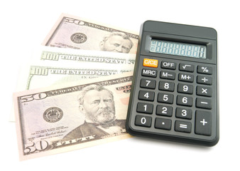 black calculator and dollars banknotes