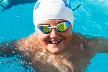 Fototapeta na wymiar Portrait of young swim student in water.