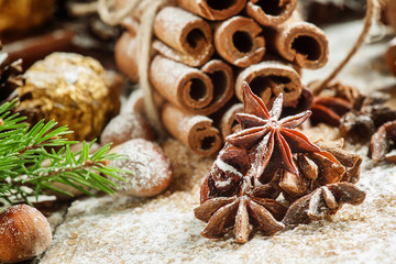 Star anise on a snowy background Christmas decoration with cinna