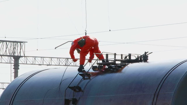 Emergency Laborer Working On Cistern With Fuel