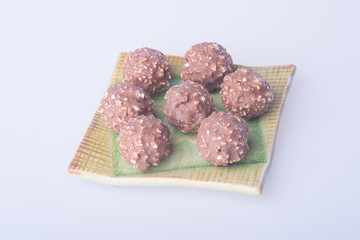 chocolate ball or chocolate bonbon on a background.