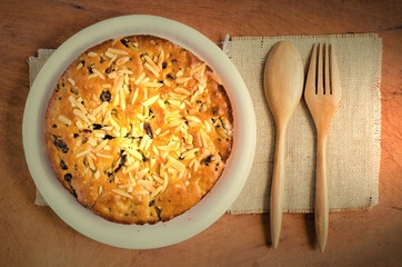 Granola bars and forks on wooden pad