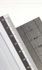 Stainless steel ruler and blank white paper note background