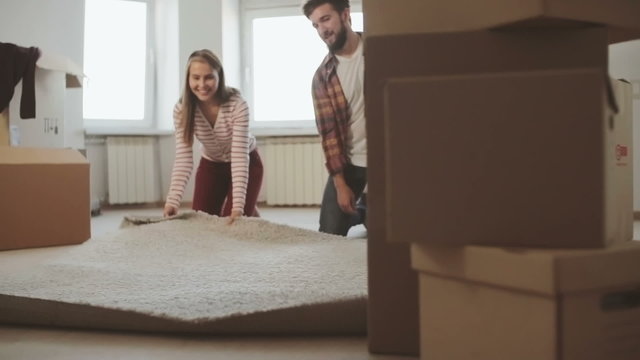 Couple doing unpacking together in their new house