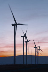 Wind mill farm at dusk. Global warming. Sustanaible energy © h368k742