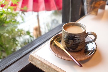 Having a cup of coffee in a café