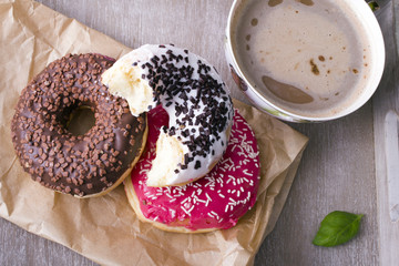 coffee and donut on wood background