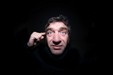 Fototapeta premium Ugly man isolated in black